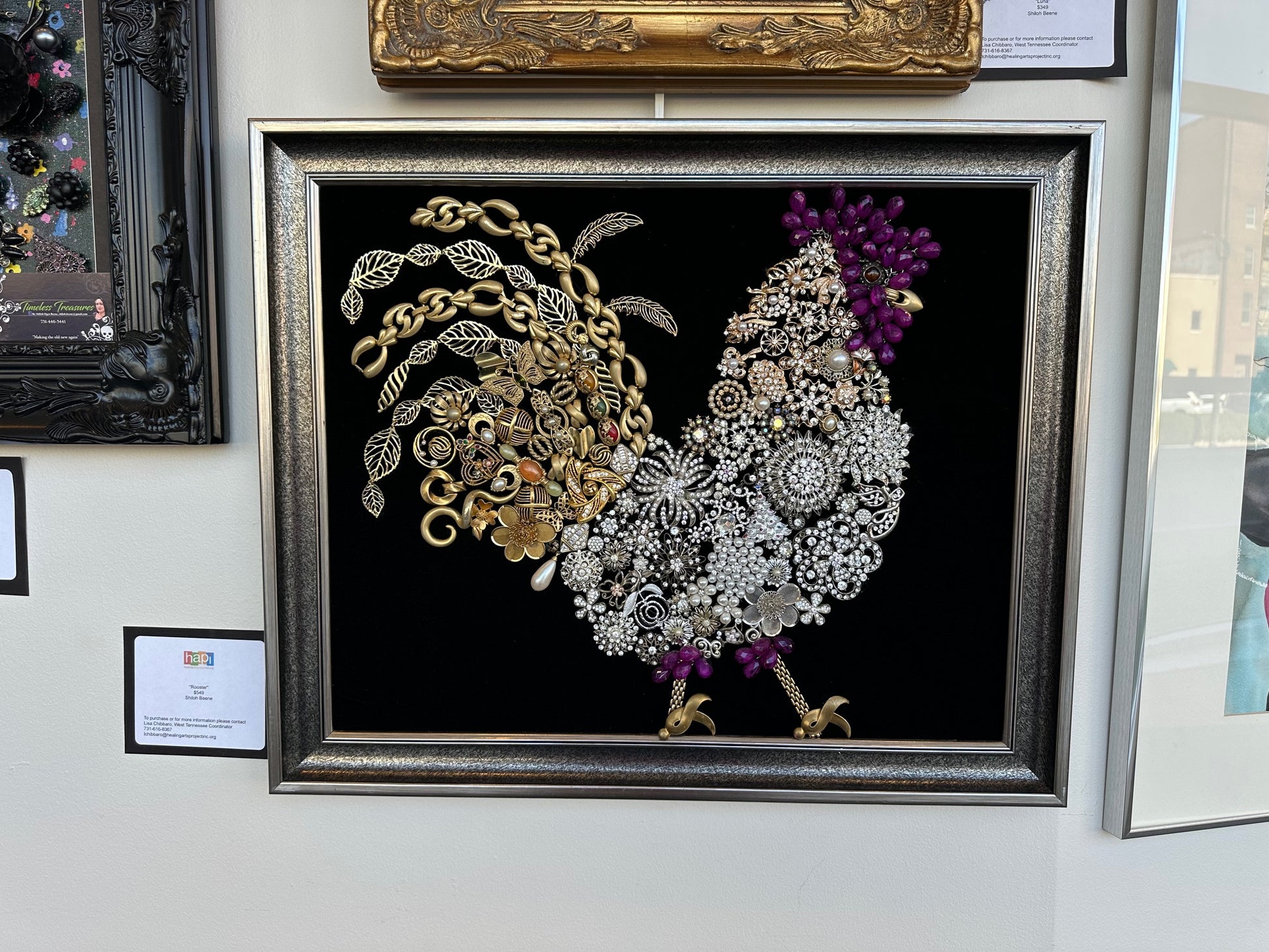 Framed artwork of a rooster made from jewelry
