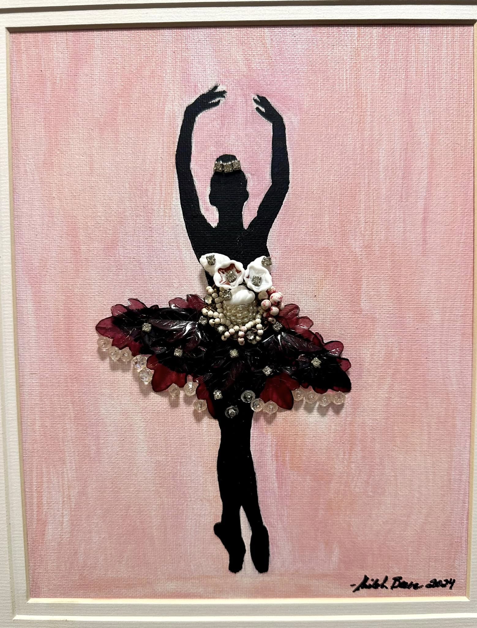 Artistic depiction of a ballerina silhouette with floral details made from vintage jewelry on a pink background in a golden frame